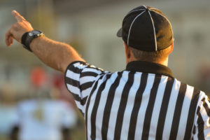 Referee calling lacrosse game