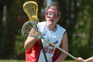 Lacrosse player running while cradling